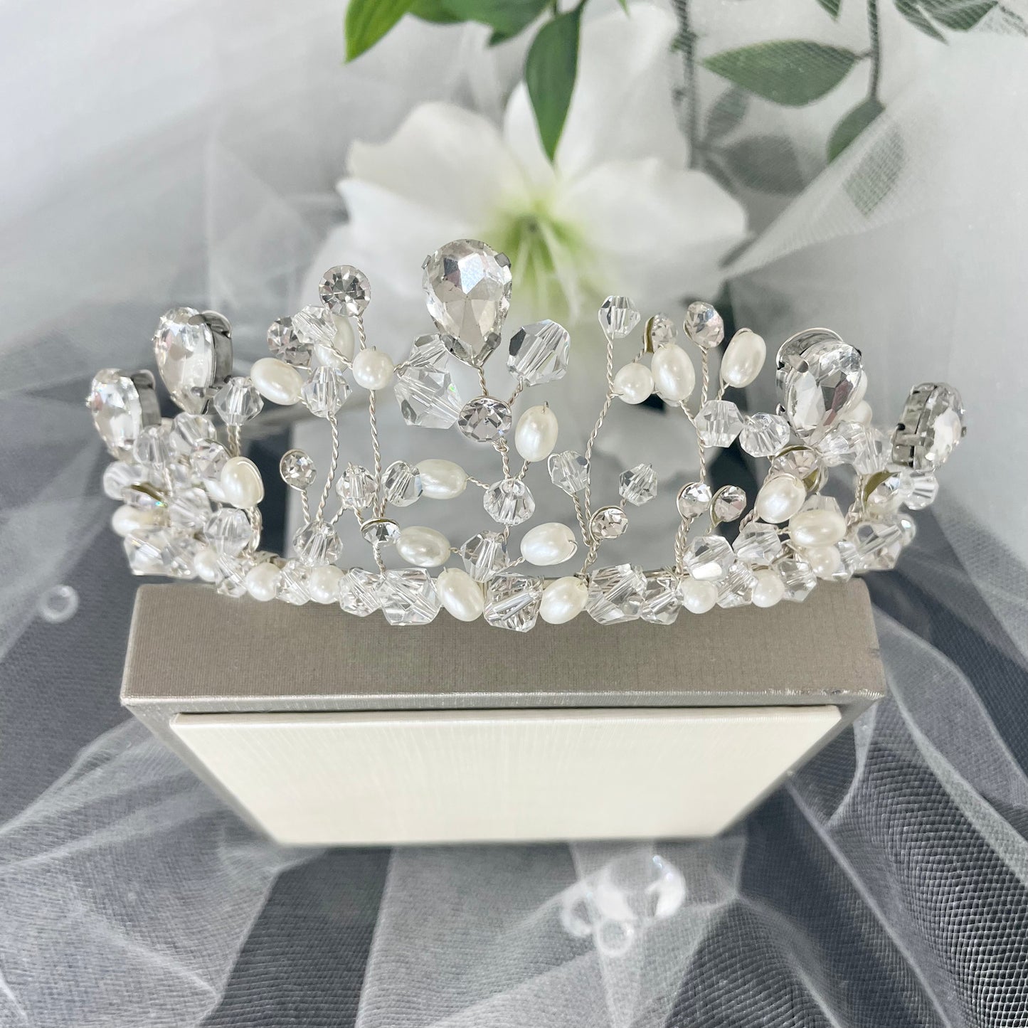 "Amara Tiara: Exquisite Handcrafted Crystal and Pearl Adorned Masterpiece."