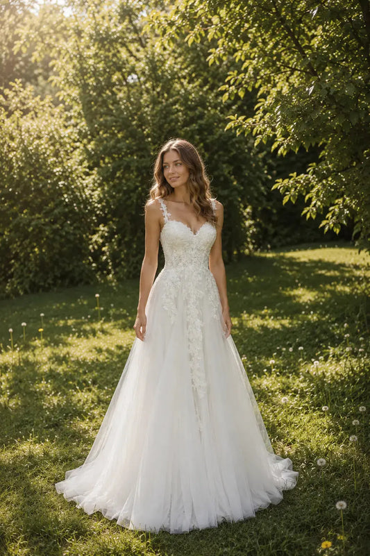 Front view of the Isabel floral lace wedding dress Melbourne with delicate straps and full skirt from Divine Bridal Macleod