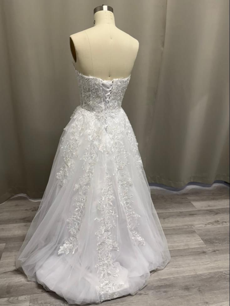 Josie Lace Appliqué Strapless Debutante Ball Gown back view showing lace-up corset and lace details on tulle skirt