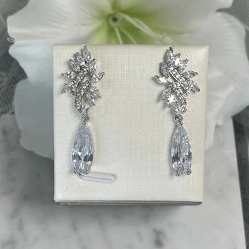 Kirsty Silver Earrings: Wavy Leaf Design with Teardrop Crystal.