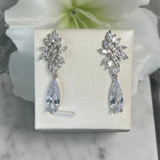Kirsty Silver Earrings: Wavy Leaf Design with Teardrop Crystal.