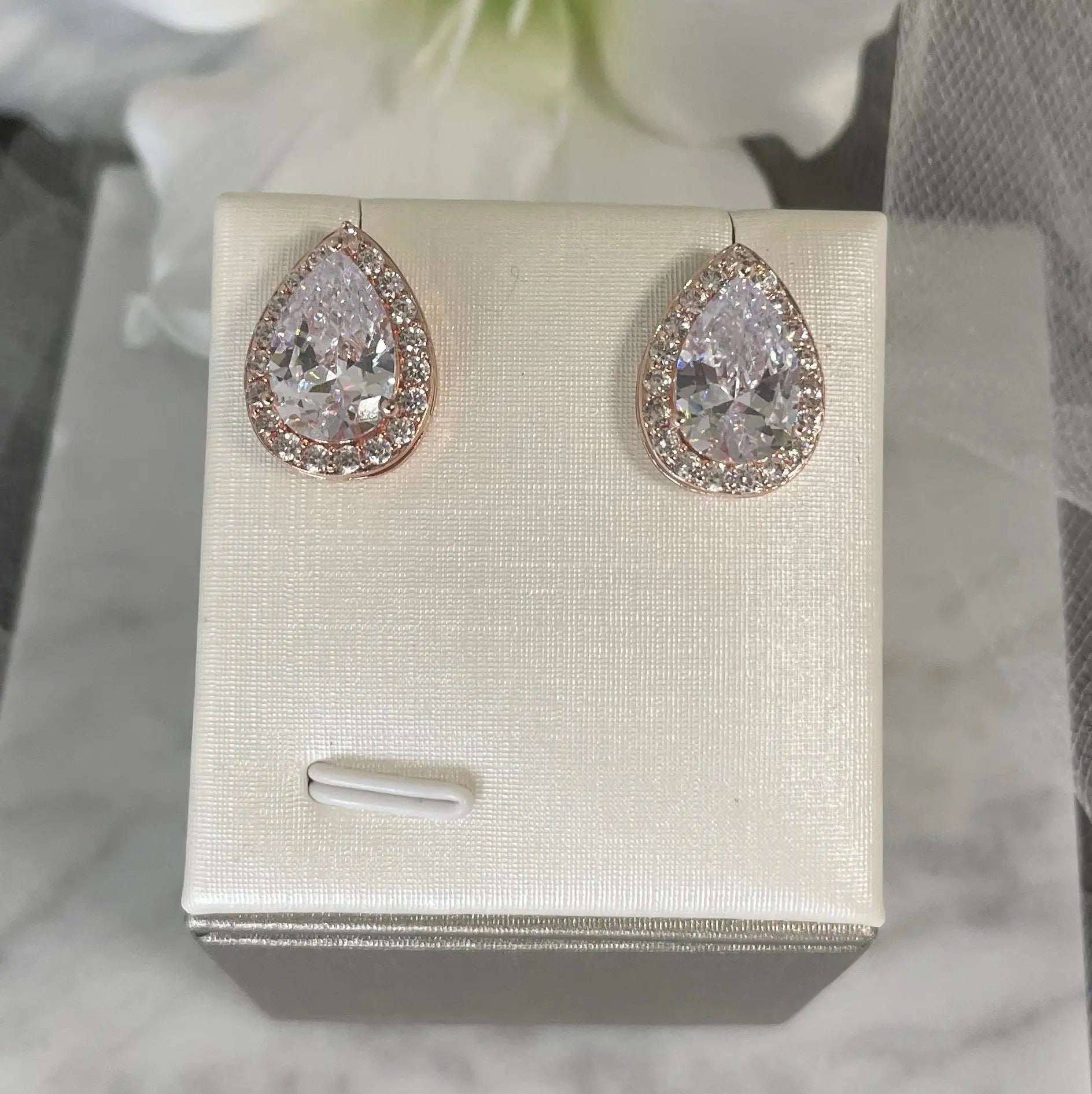 Lizzie Crystal Stud Earrings: Pear and Baguette Elegance.