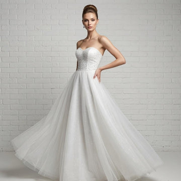 Elegant white strapless debutante dress with heavily sequined bodice and full flowing tulle skirt.
