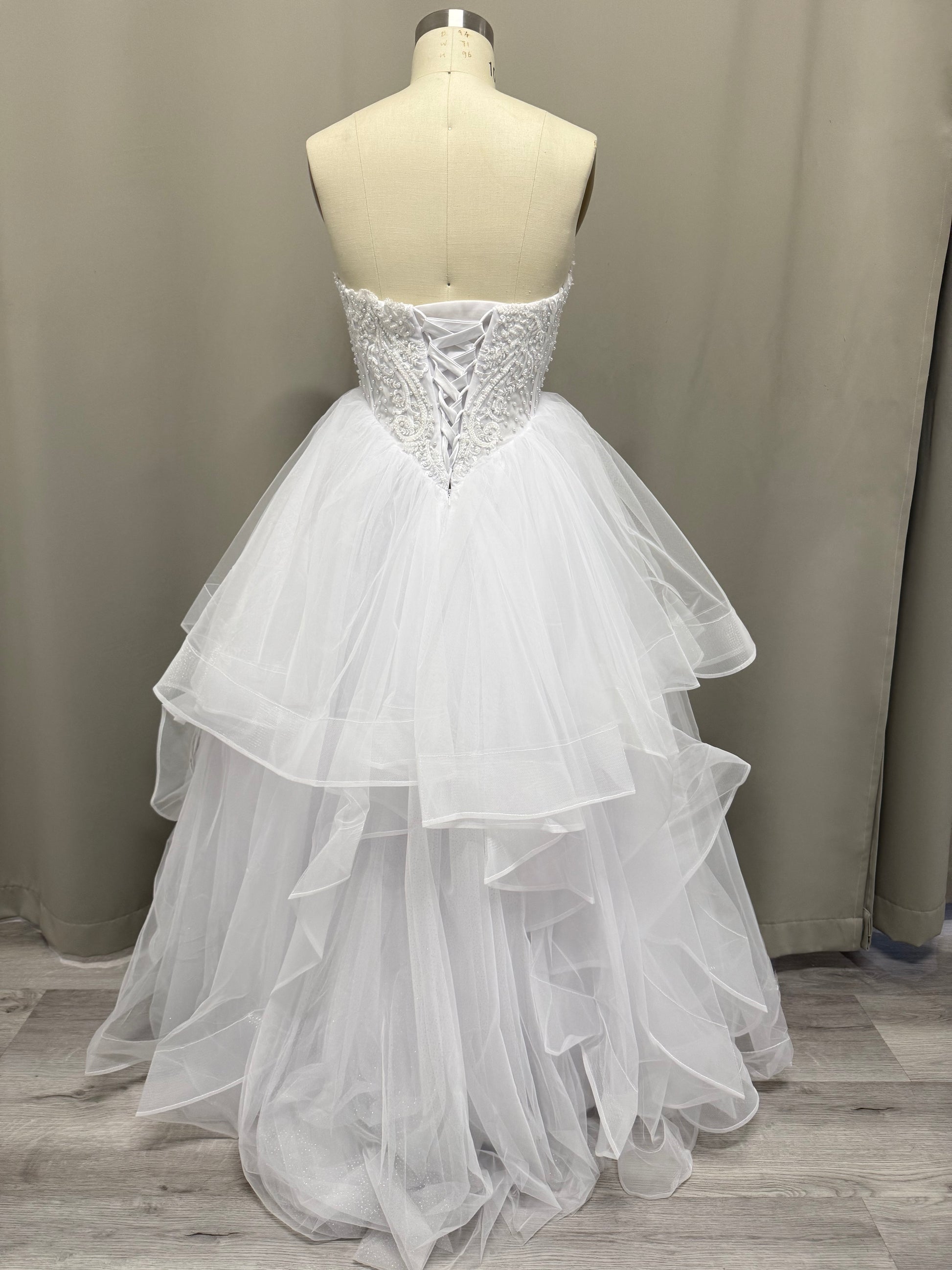 Loretta Lace Beaded Strapless Debutante Ball Gown back view showing lace-up corset and ruffled tulle skirt