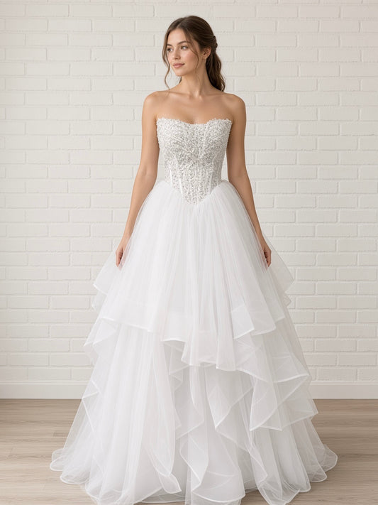 Loretta V1 white pearl debutante dress, front view on mannequin with lace corset and full ruffle skirt