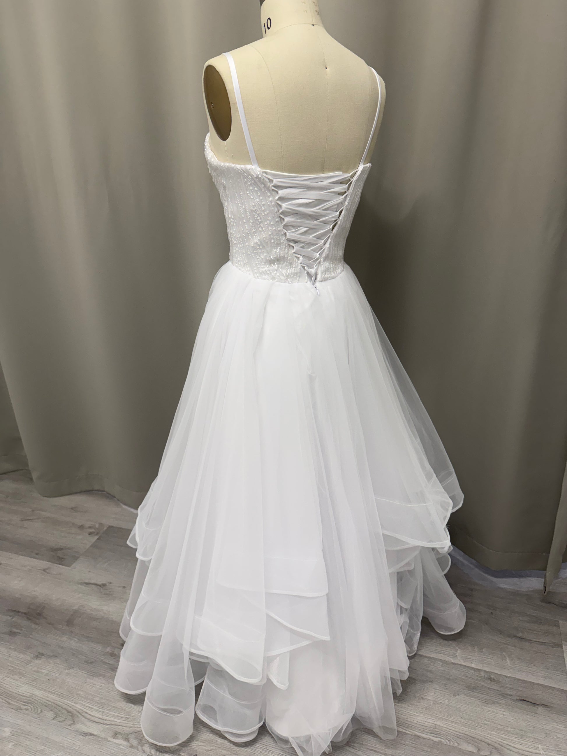 Luna Beaded Strapless Debutante Ball Gown back view with lace-up corset and ruffled tulle skirt