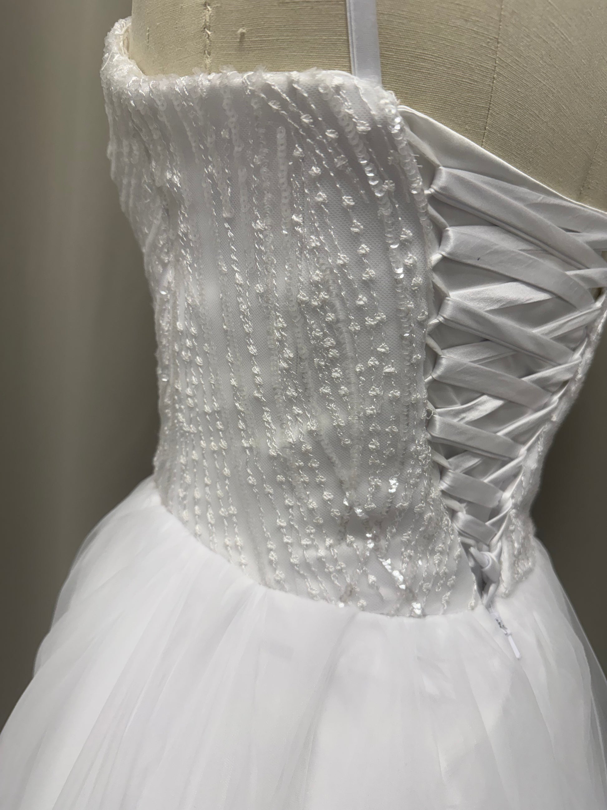 Luna Beaded Strapless Ruffled Tulle Debutante Ball Gown side view highlighting beaded bodice and layered skirt