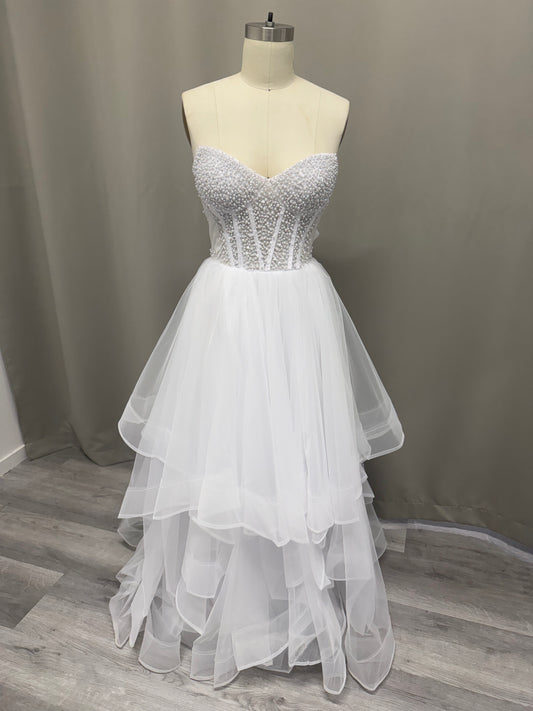 Lyra Ruffled Pearl Beaded Strapless Debutante Ball Gown on mannequin - white pearl beaded corset with multi-layered ruffled tulle skirt
