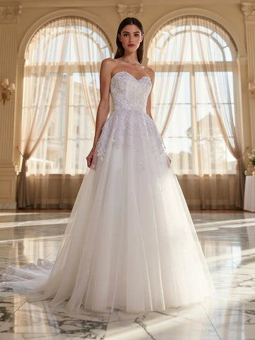 Woman in a strapless debutante dress standing in a grand room with large windows.