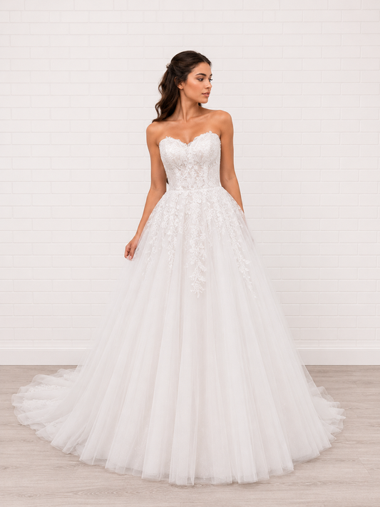 Elegant white debutante dress with a fitted lace bodice, sweetheart neckline and soft layered tulle skirt.