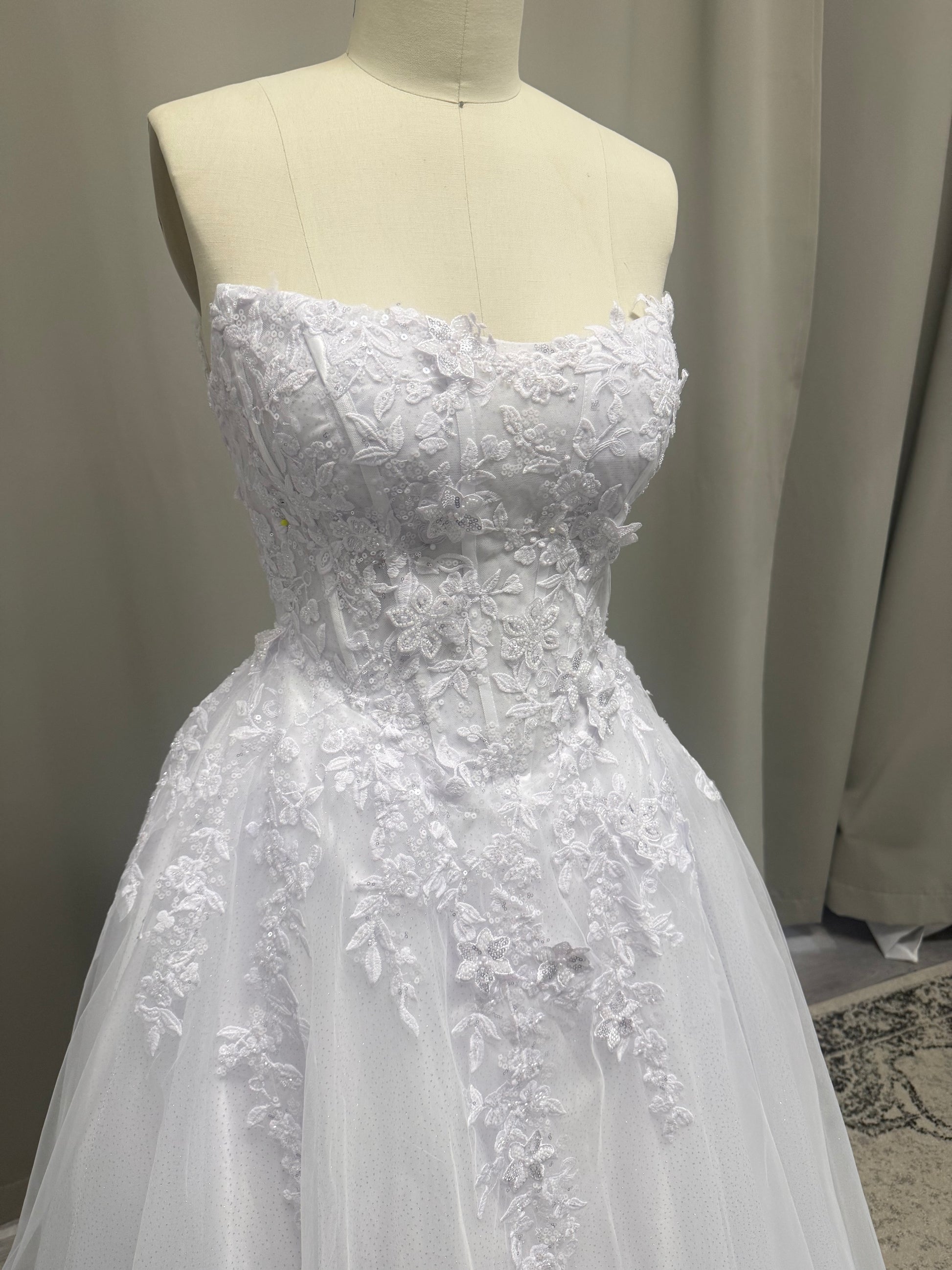 Close-up of Maya V1 floral lace debutante dress beaded floral lace bodice