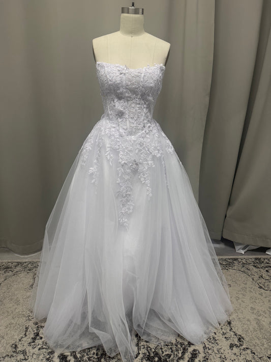 Maya V1 white floral lace debutante dress, front view on mannequin