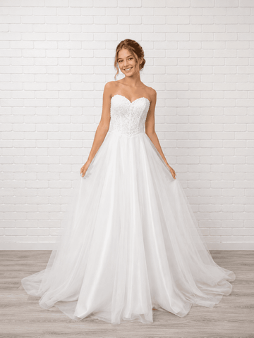 White debutante dress with a strapless lace bodice, lace-up corset back and full A-line tulle skirt.