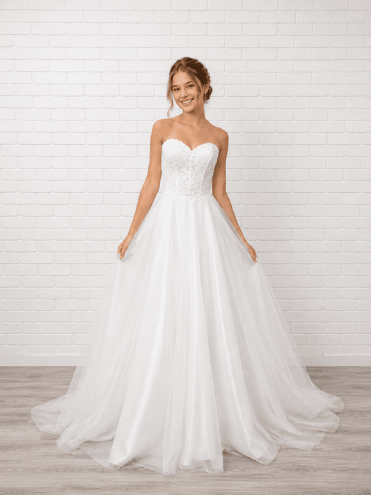 White debutante dress with a strapless lace bodice, lace-up corset back and full A-line tulle skirt.