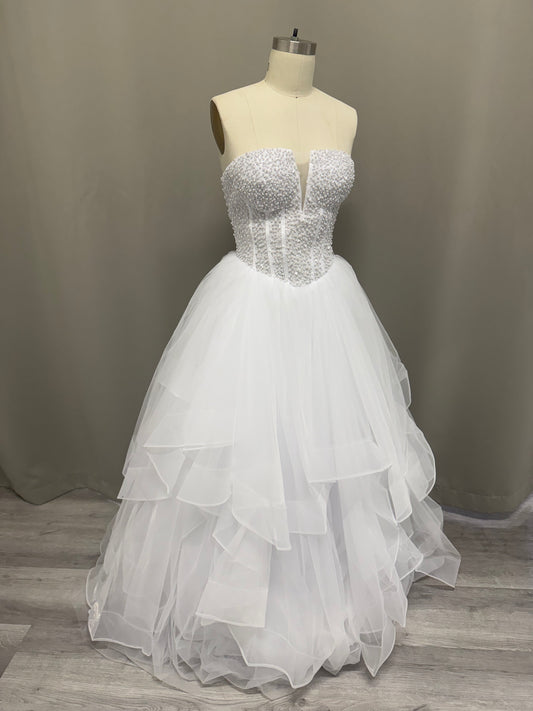Ophelia Ruffled Pearl Beaded Strapless Debutante Ball Gown on mannequin - white pearl beaded corset with multi-layered ruffled tulle skirt