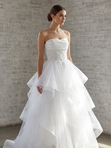 Front view of the Ruby lace ruffle debutante dress Melbourne with detailed lace bodice and layered ruffle skirt at Divine Bridal Macleod