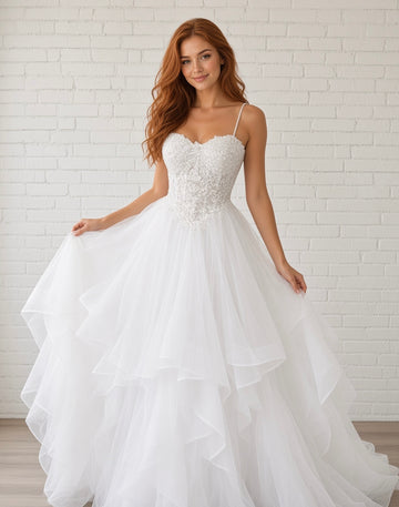 Riva white lace debutante dress, front view on model with pearl straps, sweetheart bodice and layered tulle skirt