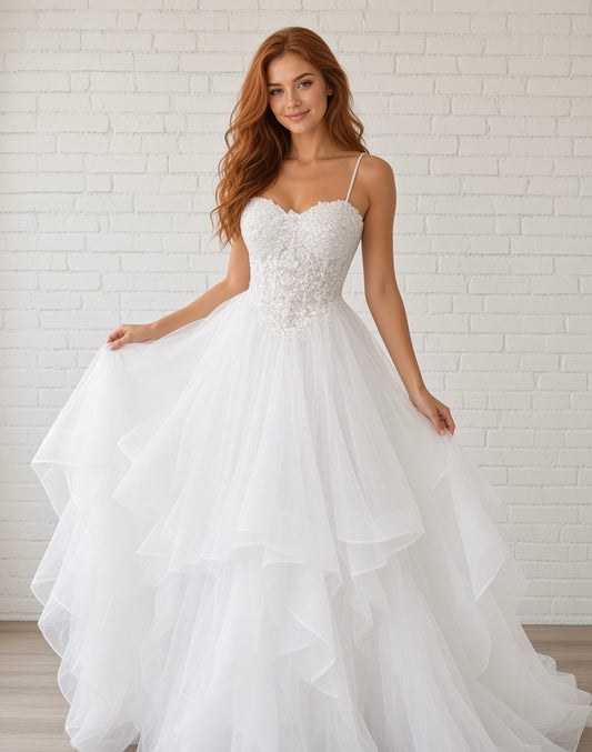 Riva white lace debutante dress, front view on model with pearl straps, sweetheart bodice and layered tulle skirt