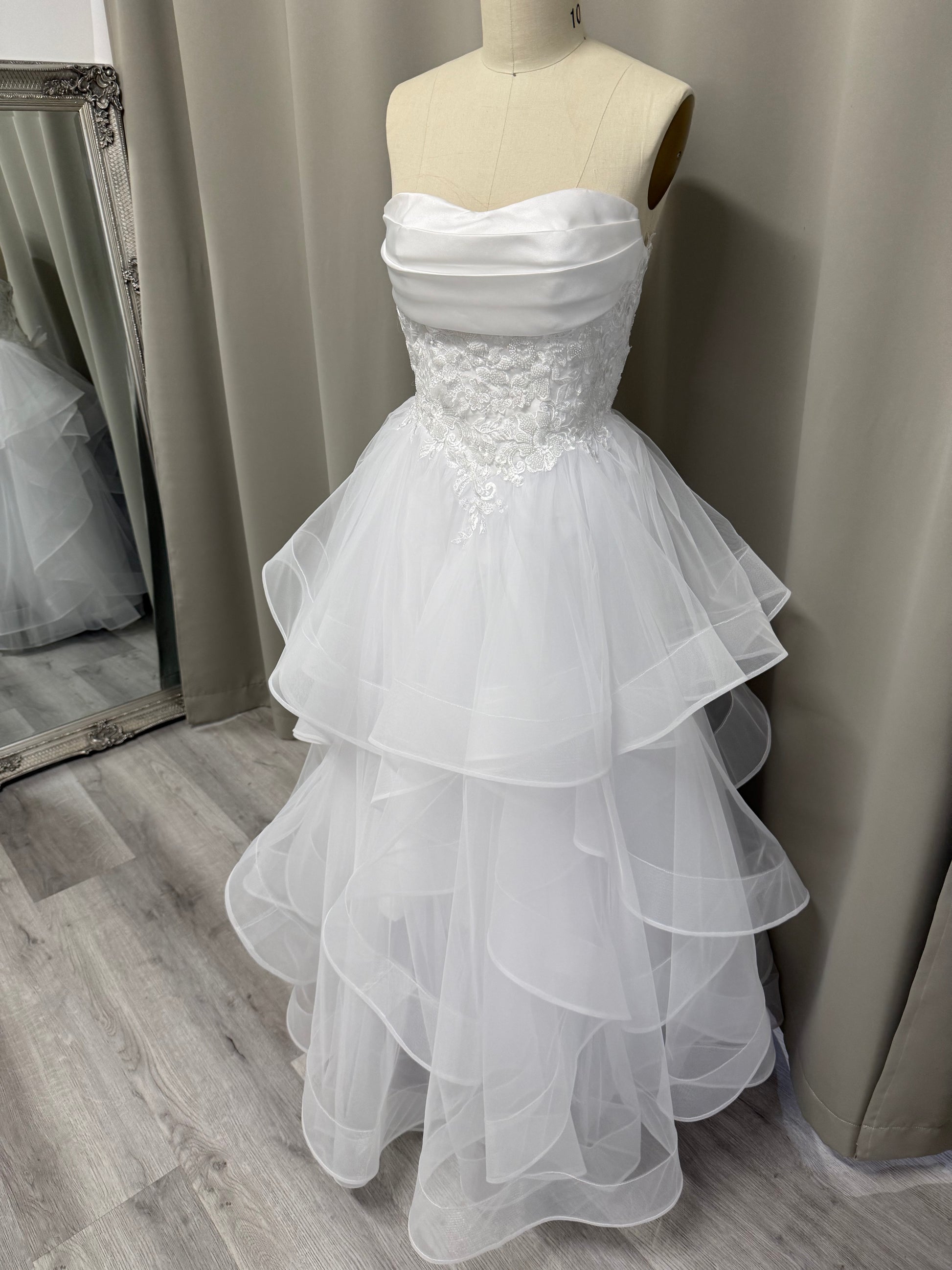 Full length shot of the Ruby lace ruffle debutante dress Melbourne displayed in our Macleod boutique