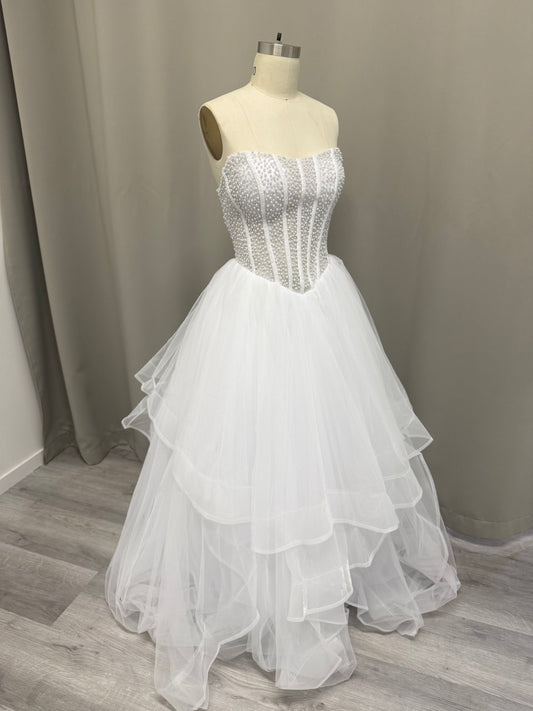 Siren Pearl Beaded Strapless Debutante Ball Gown on mannequin - white pearl corset bodice with layered high-low tulle skirt