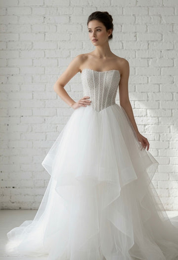 Siren Pearl Beaded Strapless White Debutante Ball Gown front view - heavily embellished pearl corset bodice and high-low tulle skirt