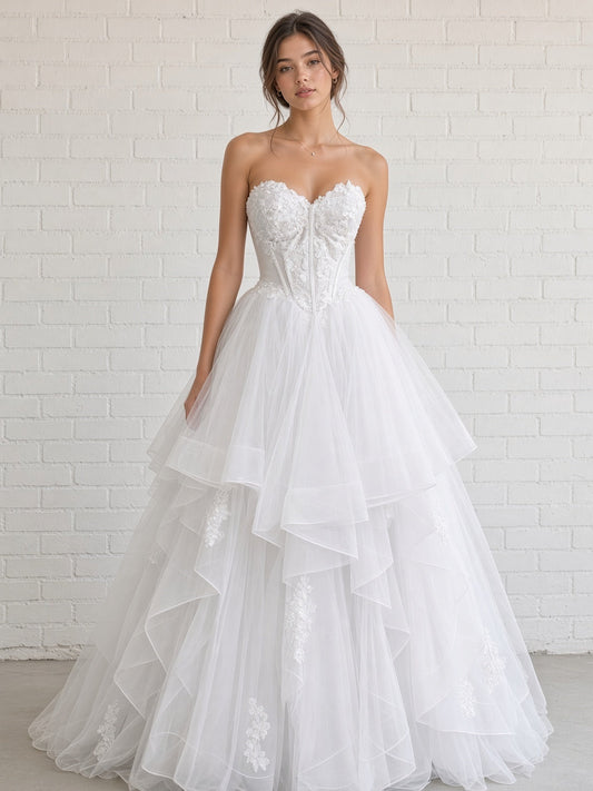 Skye V1 white floral lace debutante dress, front view on model with strapless corset and full ruffle skirt