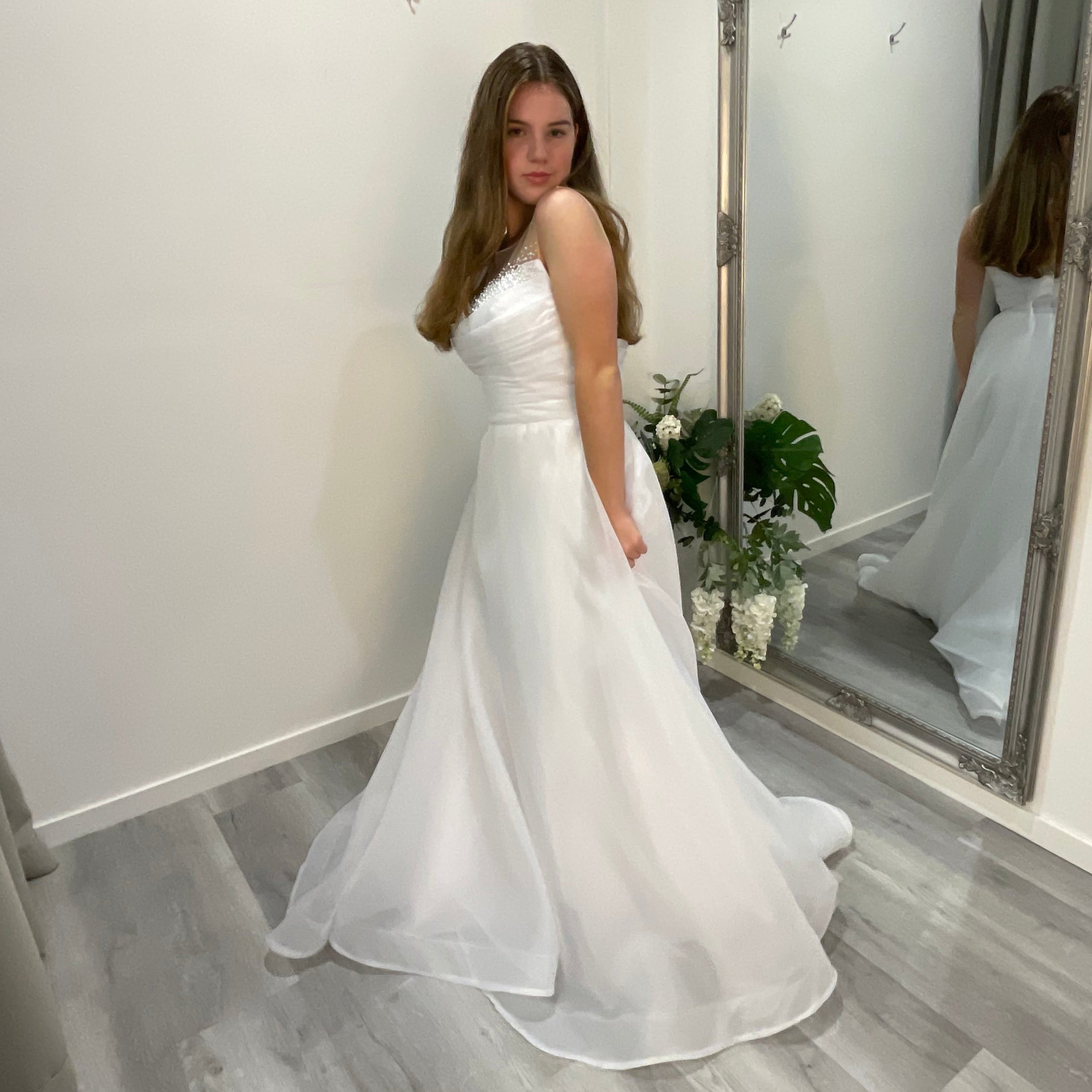 Elegant front view of Starlit Debutante Dress showcasing a beaded sweetheart neckline with Ilosian pearl detailing, complemented by organza draping and a voluminous A-line skirt.