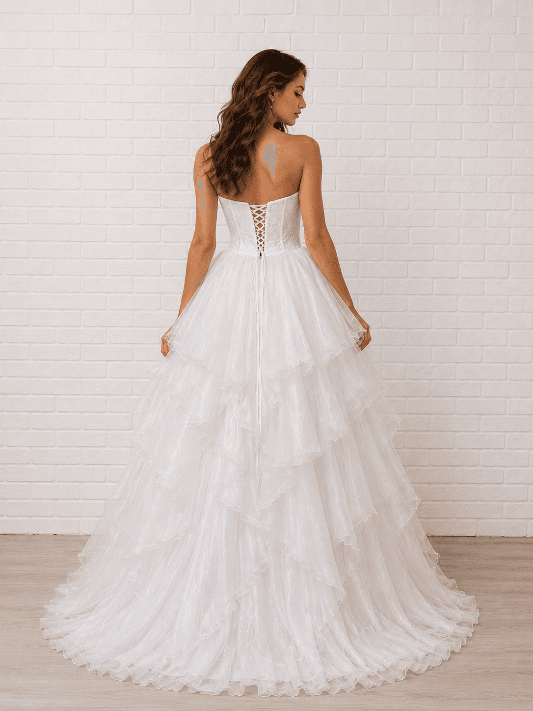 White debutante dress with a lace-up corset back and a full layered ruffle tulle skirt.