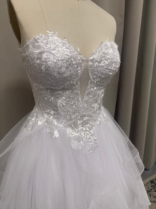 Close-up of Willow V1 plunge neck debutante dress strapless sweetheart bodice with centre plunge and floral lace appliqué