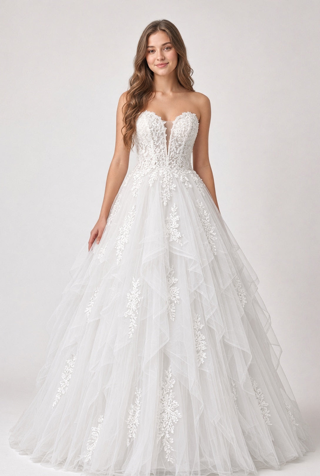 Willow V1 white plunge neck debutante dress, front view on model with strapless lace corset and full ruffle skirt
