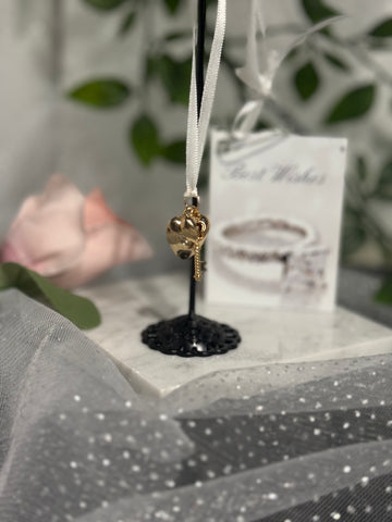 Gold Heart Key Wrist Charm - romantic gold heart and key pendant with white ribbon on display stand