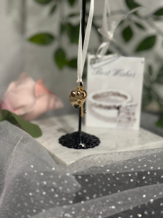 Gold Heart Key Wrist Charm - romantic gold heart and key pendant with white ribbon on display stand