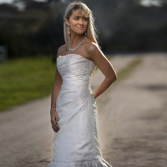 Melody Draped Lace Wedding Gown by Divine Bridal.