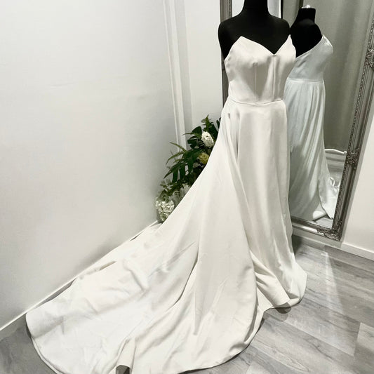 Katrin strapless wedding gown featuring an A-line cut and chic side split.