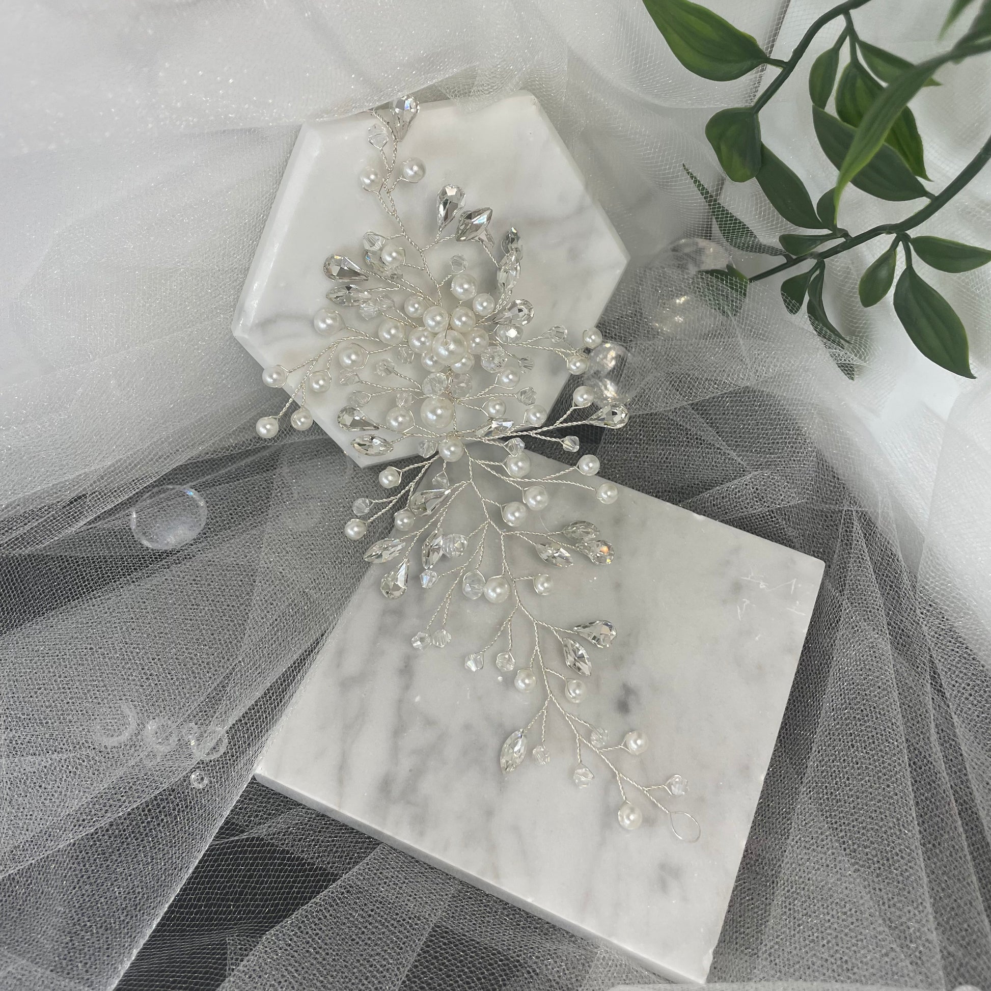 Elegant Cora Bridal Hair Vine featuring sparkling Diamantés, crystals, and pearls on a silver wire, designed to add a glamorous and radiant shine to bridal hairstyles.