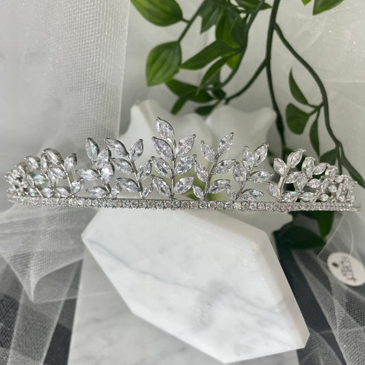 Ollie Bridal Wedding Tiara Headpiece in Silver, featuring an elegant leaf design with sparkling diamantés, ideal for enhancing a bridal look with sophistication and regal charm.