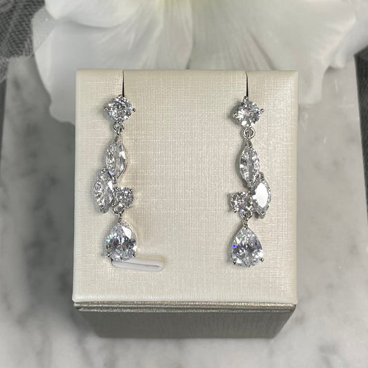 Julie cubic zirconia crystal wedding earrings featuring a sparkling round crystal, twin leaf-shaped designs, and a teardrop finish, perfect for adding sophistication to any outfit.