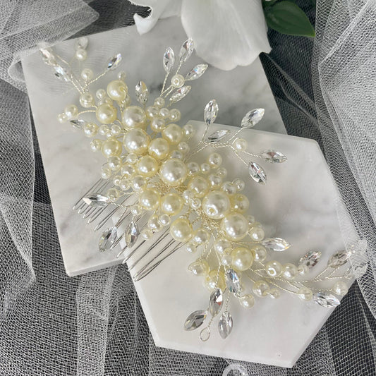 Handcrafted Dina Bridal Hair Comb featuring a blend of pearls and diamanté in a leaf design, set on a silver comb, ideal for adding elegance and class to any bridal hairstyle.