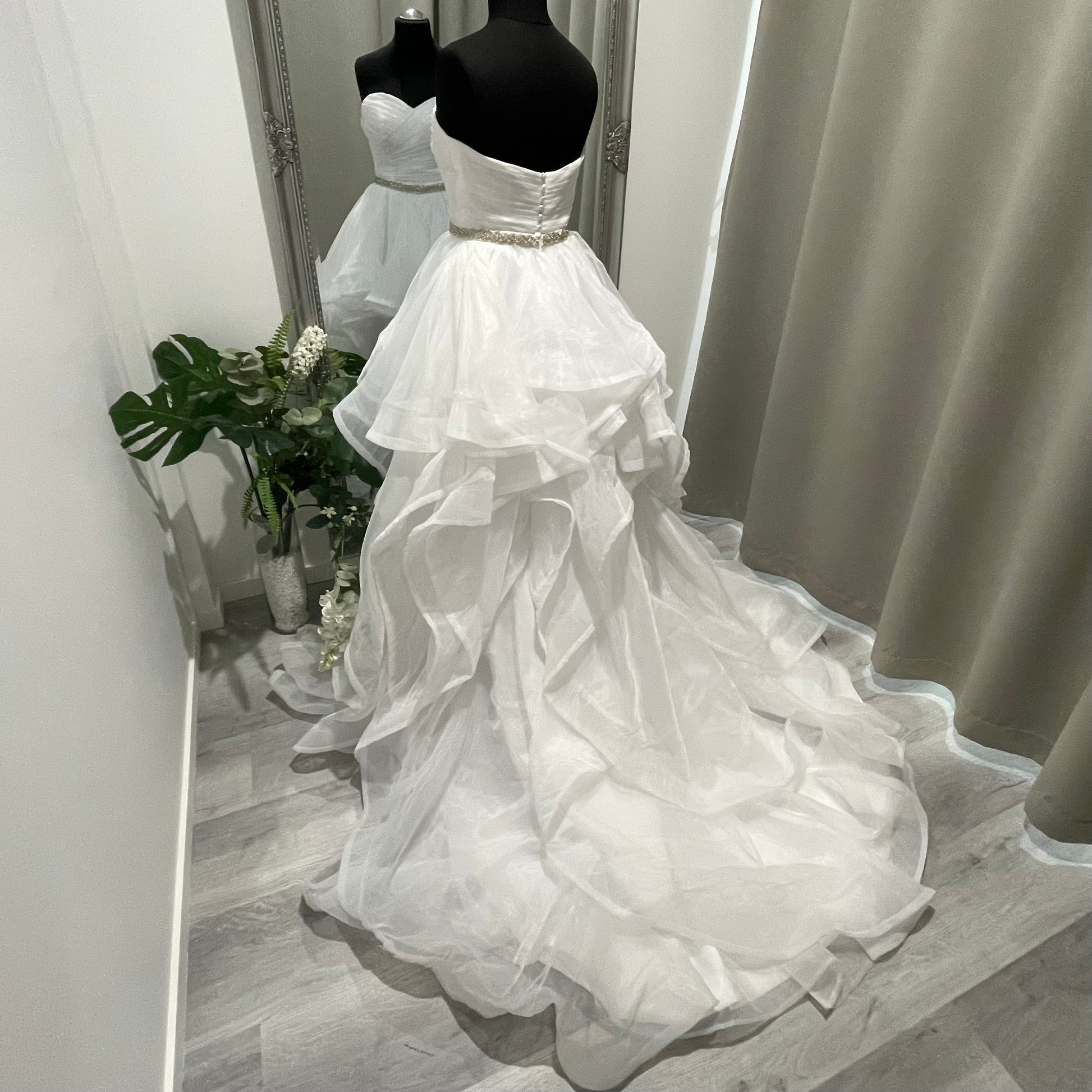 Thelma Gown featuring a strapless sweetheart neckline and a ruffled A-line skirt with horsehair finishing layers.