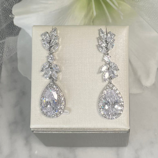 Bloom wedding earrings with leaf-shaped crystals and a central teardrop crystal surrounded by small rounds, crafted in elegant 18k gold/silver plated finish, perfect for bridal elegance.