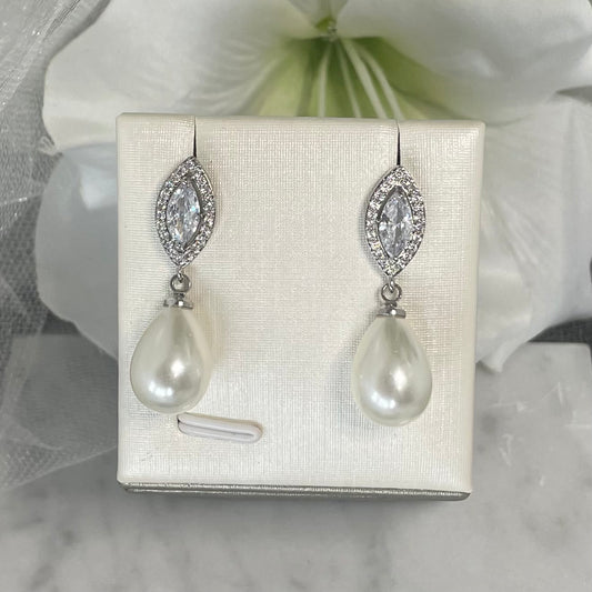 Carissa crystal pearl earrings with an intricate leaf design and teardrop pearl, crafted in high-quality silver and gold plating, perfect for adding classic elegance to bridal attire.
