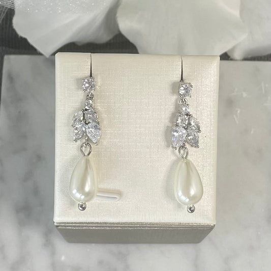 Sadie crystal pearl earrings with round top crystal, leaf-like crystal cluster, and teardrop pearl, perfect for adding timeless elegance to bridal attire.