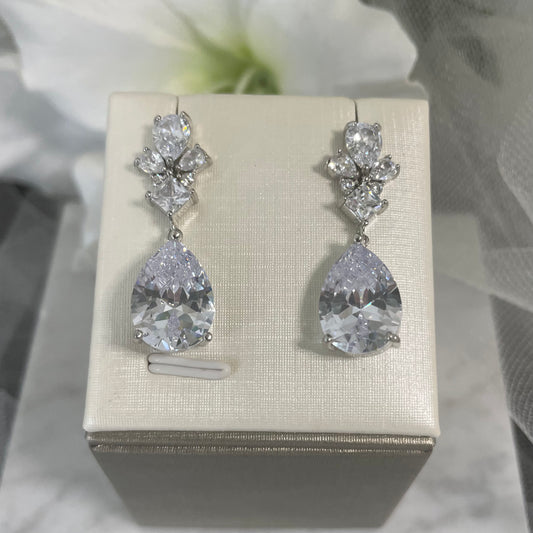 Talia Crystal Drop Bridal Earrings in Silver and Rose Gold, featuring sparkling zircon crystals, perfect for enhancing any bride's look on her wedding day.