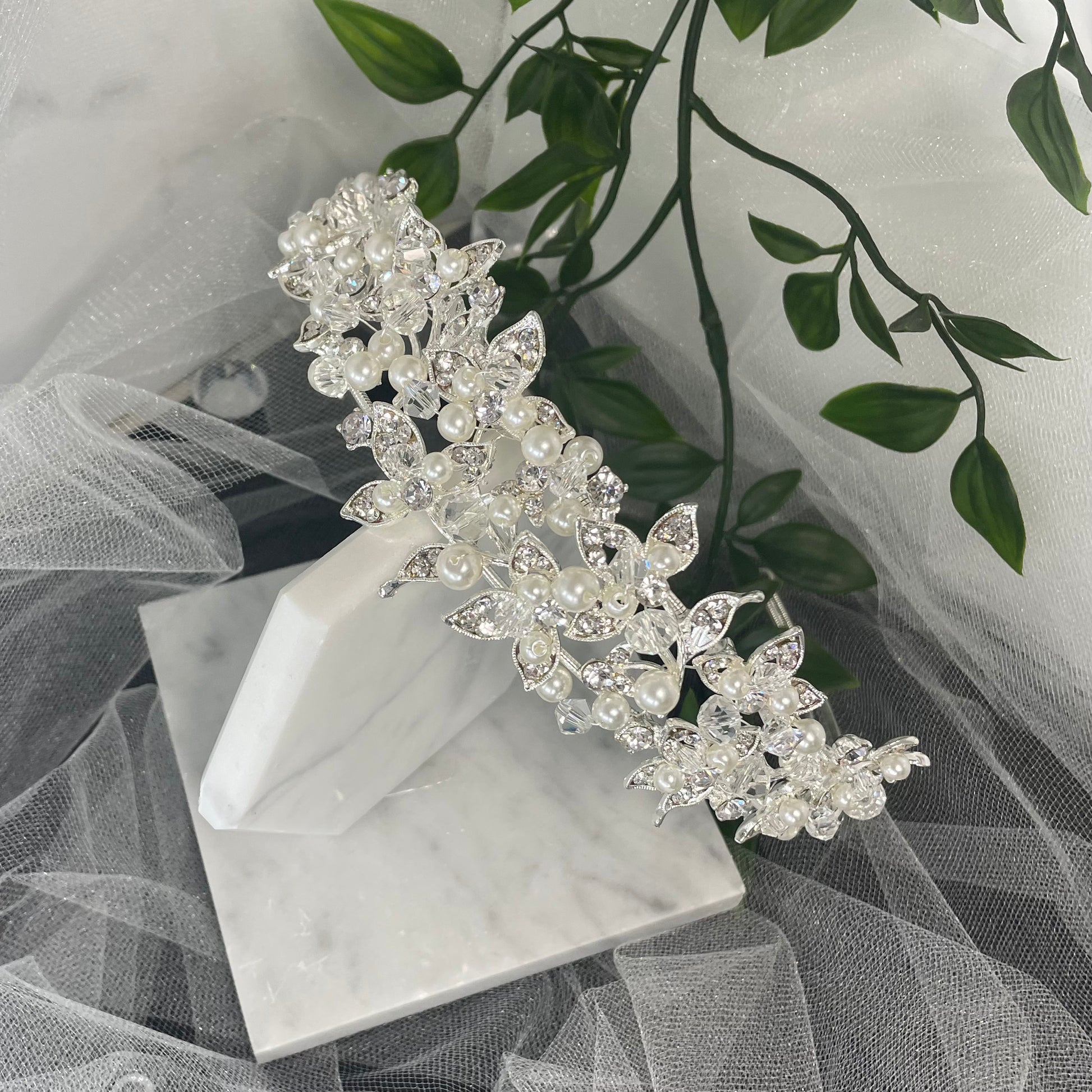 Exquisite Iris Bridal Headpiece with a floral design, adorned with pearls, crystals, and Diamontes, ideal for enhancing a sophisticated bridal hairstyle.