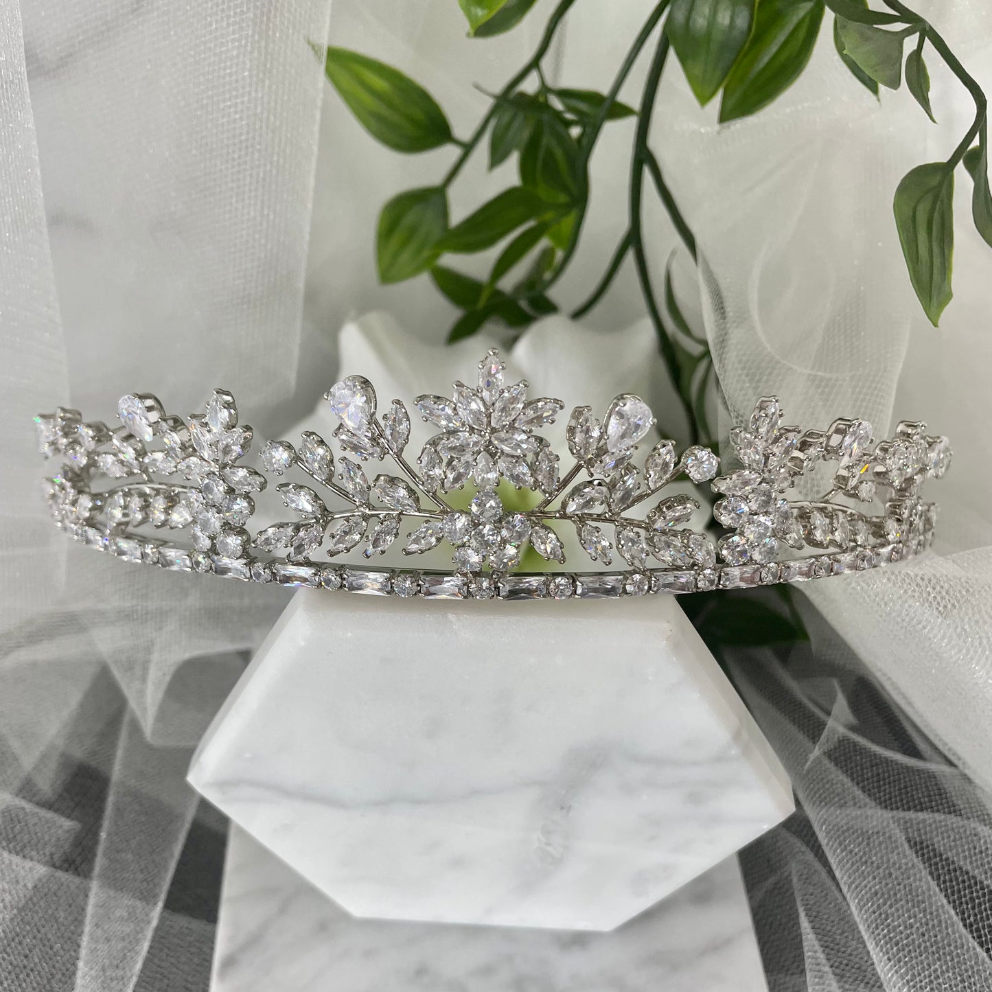 Nia Rhinestone Crystal Bridal Wedding Tiara in Silver, featuring an elegant design of diamanté crystals in floral and leaf patterns, perfect for enhancing a modern bride's look.