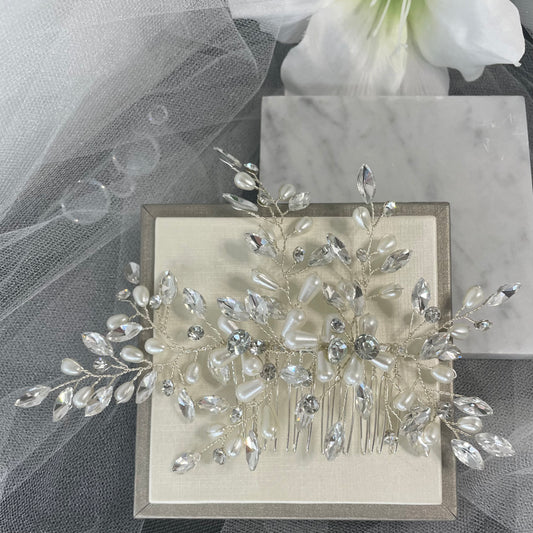 Exquisite bridal hair comb adorned with sparkling diamantés and pearls on a sturdy wire, perfect for enhancing wedding and special event hairstyles.