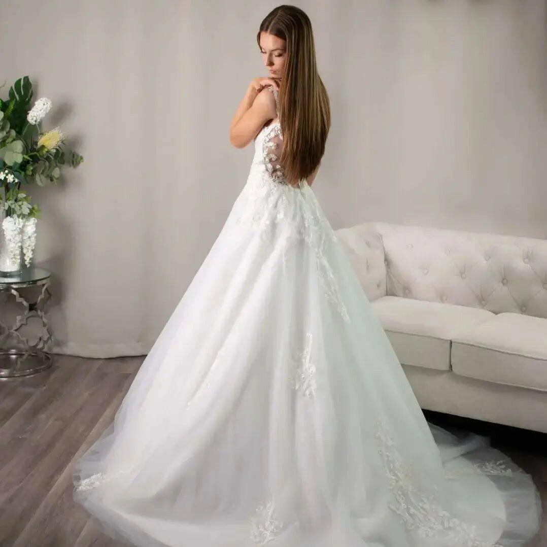 Lucia: V-neckline in Lace simple elegant wedding dress.
