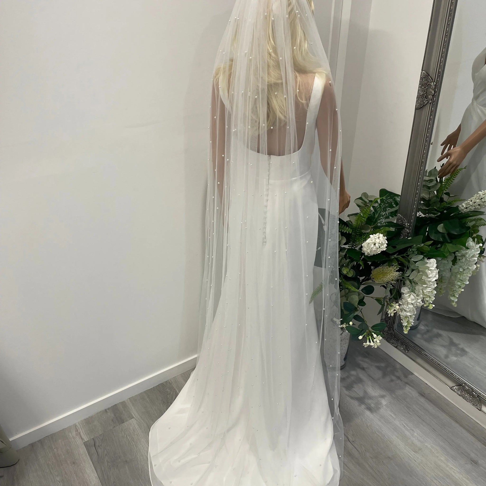 Back view of 2-meter pearl cathedral veil in soft tulle with silver-backed pearls