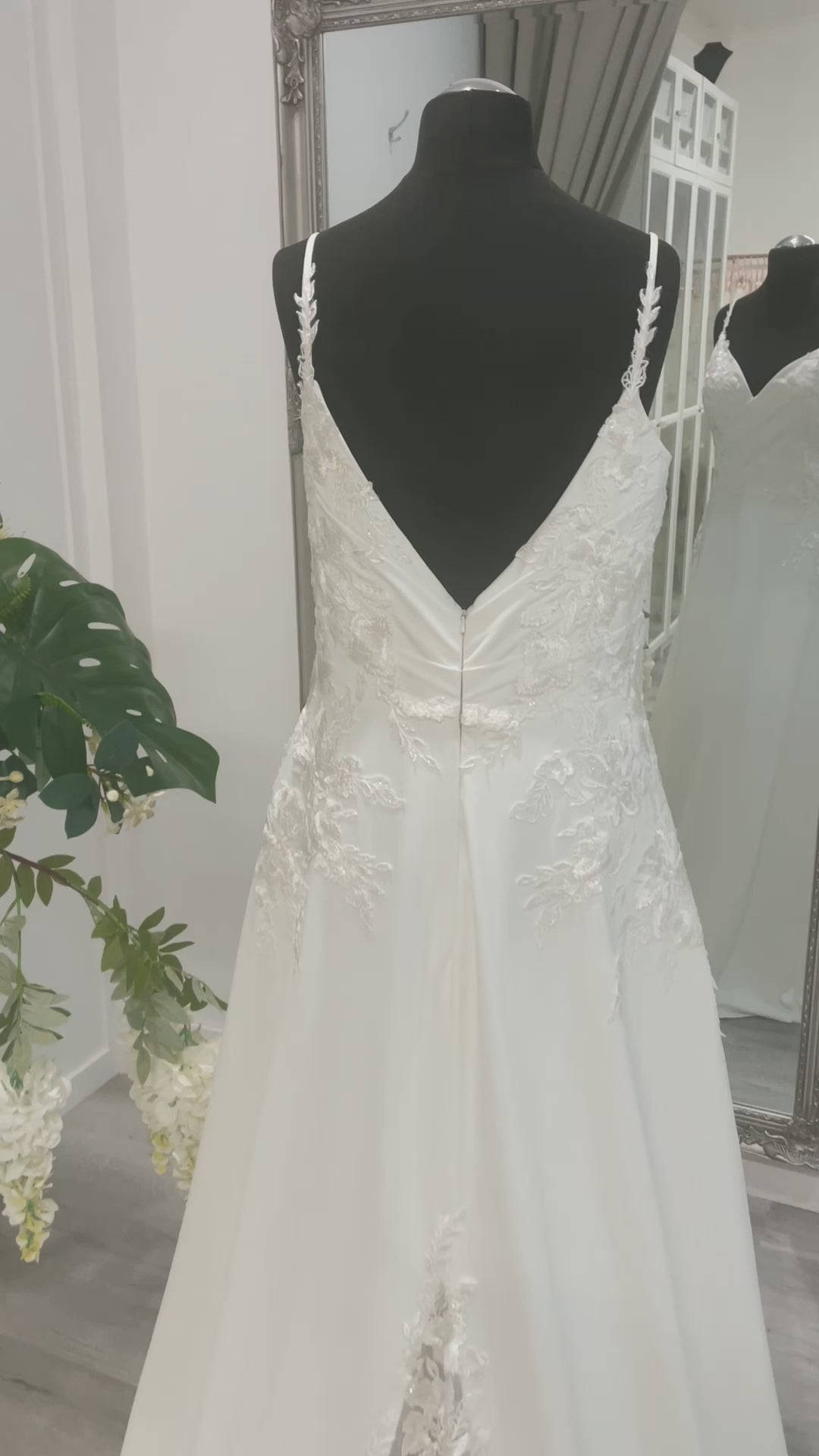 Harlow Wedding Dress with lace detailing and V-neckline on display at Divine Bridal salon.
