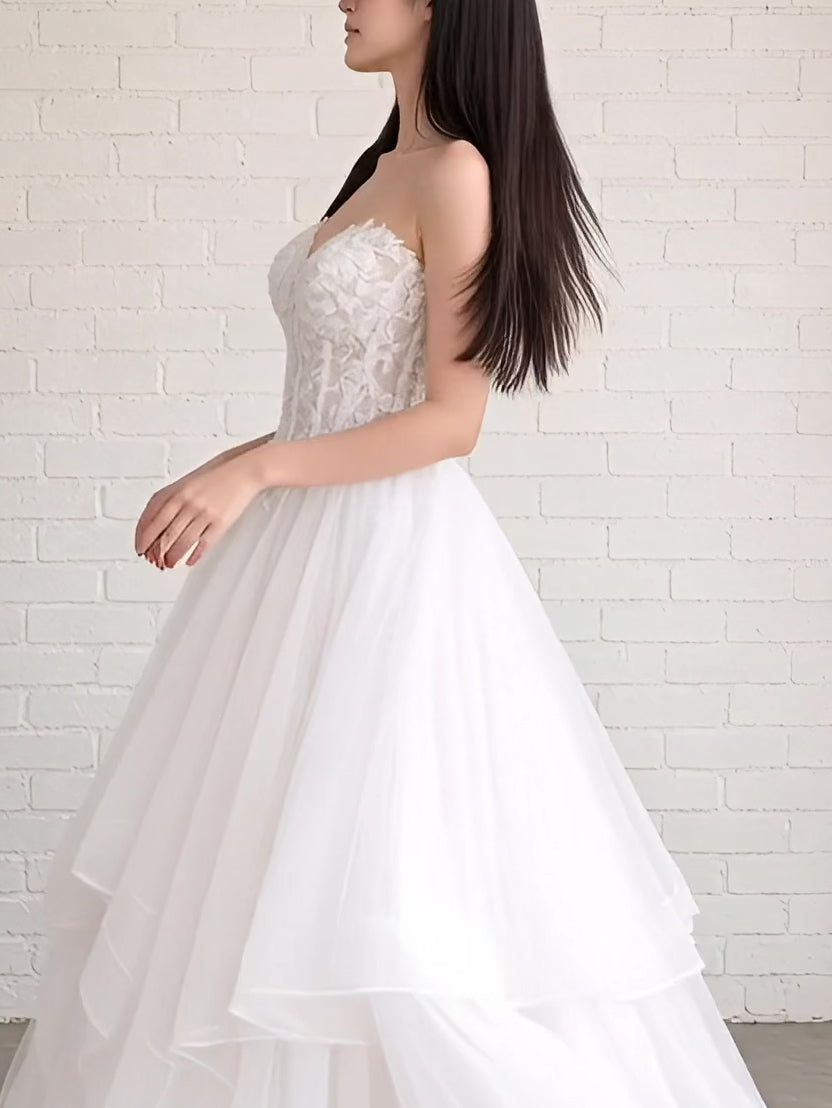 Abby V1 sheer corset debutante dress video – strapless lace gown with sheer panels and full ruffle skirt shown on the Model